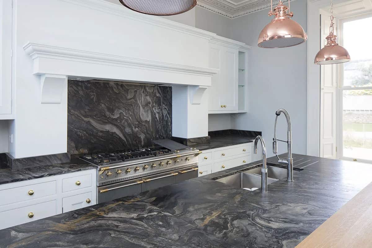 Copper Accents, London Black Quartzite in a leather finish detail, fabricated and installed by Miller Brothers Stone