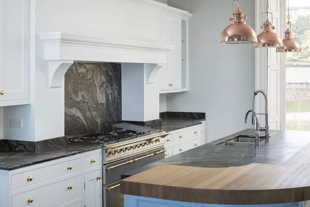 Copper Accents, London Black Quartzite in a leather finish detail, fabricated and installed by Miller Brothers Stone