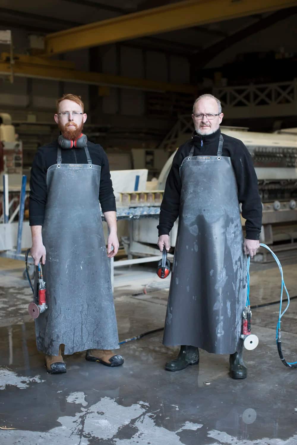 Two of the Miller Brothers team in leather aprons on the workshop floor at Rathnew, Co. Wicklow
