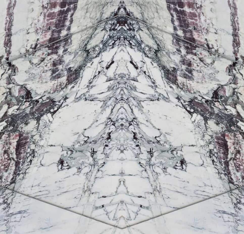 Two slabs book-matched into a mirrored butterfly of violet and white veining